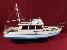 A 'Grand Banks 32' static model yacht.