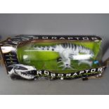 Radio controlled Robonetics Roboraptor animated dinosaur in original box,