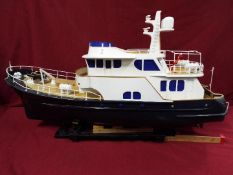 A 'Grand Banks' radio controlled luxury model yacht.
