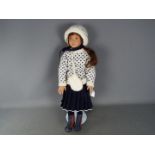 A Sonja Hartmann vinyl dressed doll, signed to the back of the neck, approximately 58 cm (h),