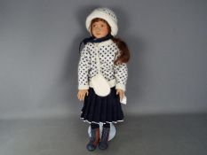 A Sonja Hartmann vinyl dressed doll, signed to the back of the neck, approximately 58 cm (h),