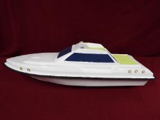 A fibreglass model of a luxury yacht.