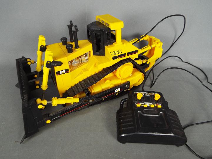 Matchbox - An unboxed 1990s Matchbox wired remote controlled Caterpillar Bulldozer.