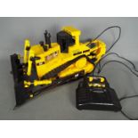 Matchbox - An unboxed 1990s Matchbox wired remote controlled Caterpillar Bulldozer.
