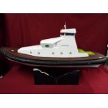 A fibreglass constructed prototype model of a yacht entitled 'Venture' .