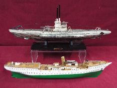 A resin model on stand of a U-Boat measuring approximately 20cms (H) x 48cms (L) x 7cms (W)