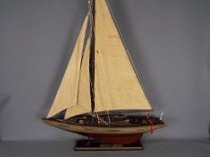 A large static model of a sea going yacht 'Miss Take'.