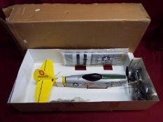 A boxed unmarked Mustang P51 radio controlled model aircraft.