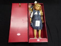 Gotz - A boxed, vinyl dressed doll by Gotz, blonde hair, necklace and bracelet,