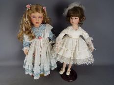 Alberon - Two limited edition, porcelain, dressed dolls by Alberon, the first numbered 272/2000,