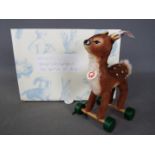 Steiff - A boxed, limited edition Steiff # 681417 'Fawn On Wheels ornament', white tag,