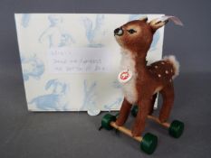 Steiff - A boxed, limited edition Steiff # 681417 'Fawn On Wheels ornament', white tag,