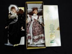 Cotswold Mint, Seymour Mann - Two boxed porcelain collectors dolls.