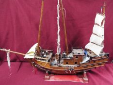 A static wooden model of a Chinese Junk.