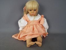 Gotz - A vinyl dressed doll by Gotz, marked to the back of the neck Gotz 486-20,