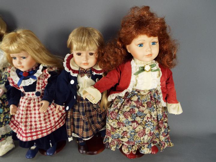 4 Collectable painted dolls with glass eyes (3 on stands). - Image 3 of 7