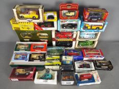 Vanguards, Saico, Matchbox, Classix, Others - Over 20 boxed diecast vehicles in various scales.