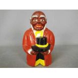 A vintage, American, ceramic money bank in the form of a bust of 'Uncle Mose',