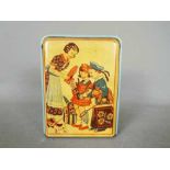 A vintage German, tinplate novelty money bank, one side printed with two children and their mother,