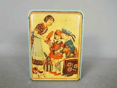 A vintage German, tinplate novelty money bank, one side printed with two children and their mother,