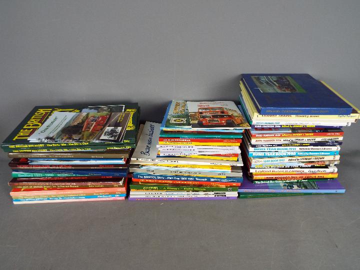 Approximately 60 hardback books relating to buses and coaches contained in three boxes.