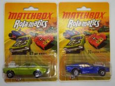 Matchbox - Two carded Matchbox ‘Rolamatics’ diecast vehicles.