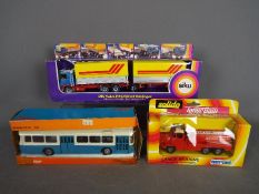 Tekno, Solido, Siku - Three European boxed diecast vehicles in various scales.