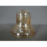 A vintage, carnival glass, money bank in the form of the Liberty Bell, approximately 9.