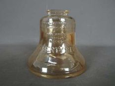 A vintage, carnival glass, money bank in the form of the Liberty Bell, approximately 9.