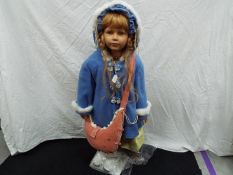 A very large, limited edition, German vinyl dressed doll,