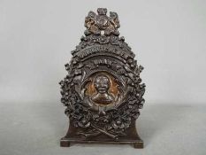 A cast iron money bank, marked 'Our Kitchener Bank, 1914',