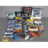 Maisto - Hot Wheels - Others. Collection of 30 mostly boxed diecast vehicles in various scales.