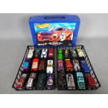 Hot Wheels - Hot Wheels carry case complete with inner trays and 24 vehicles.