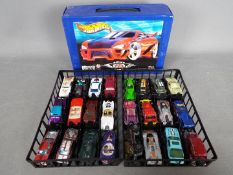 Hot Wheels - Hot Wheels carry case complete with inner trays and 24 vehicles.