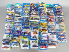 Hot Wheels - A collection of 72 unopened Hot Wheels vehicles including TV Series Batmobile,