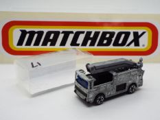Matchbox - A 'First Shot' model of a Matchbox #63 Merryweather Snorkel Fire Truck.