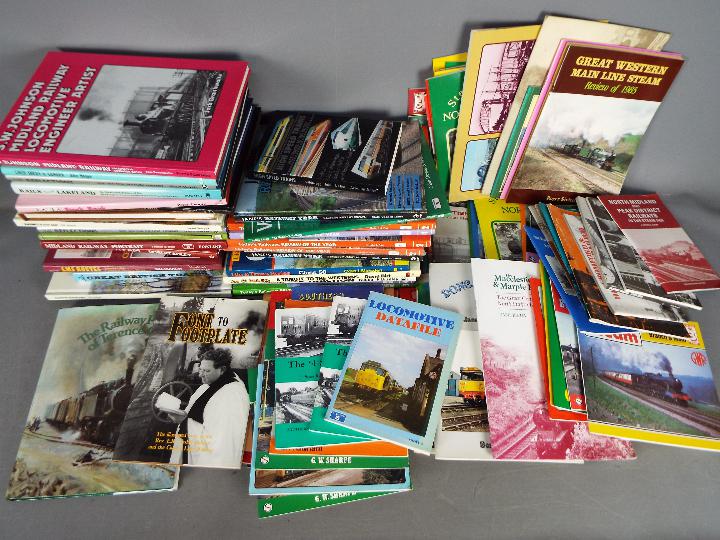 Approximately 60 hardback books and magazines relating to trains and railways contained in three