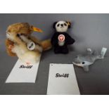 Steiff - three Steiff Animals to include a Panda #039423, a Kecki #070075 and a Dolphin #035708,