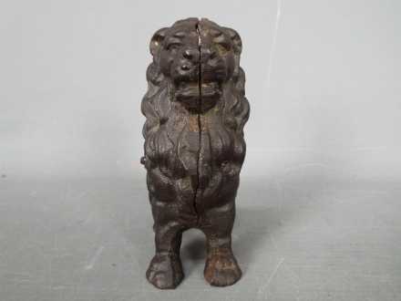 A cast iron money bank in the form of a seated male lion, - Image 2 of 5