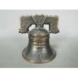 A vintage, cast iron, American novelty money bank, in the form of the Liberty Bell,