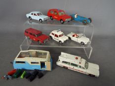 Dinky Toys - An unboxed grouping of eight Dinky Toys with some loose Dinky / Corgi plastic