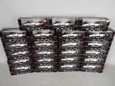 Onyx - A collection of approximately 23 boxed 1:43 scale diecast 'Indy Cars' by Onyx.