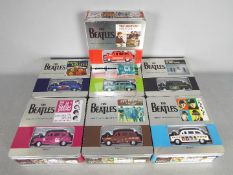 The Beatles - Seven 'The Beatles Single Sleeve Die Cast Collectable Tins' .