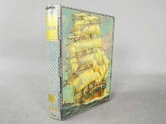 A Chad Valley novelty tinplate money box in the form of a book,