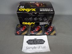 Onyx - A trade box of 24 diecast 1:43 scale diecast F1 racing cars.