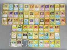 A COMPLETE SET OF 62 POKEMON 'FOSSIL' TRADING CARDS - Lot includes 1st Edition #22 'Hitmonlee' and