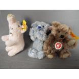 Steiff - three Steiff soft toys to include a pig #112034 with button and yellow tag,