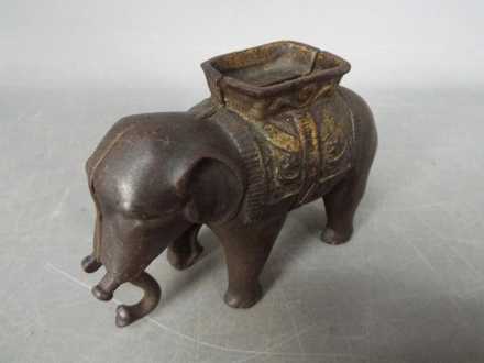 A vintage, cast iron, money bank in the form of an elephant, - Image 3 of 5