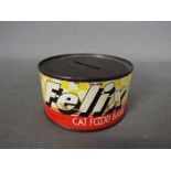 A vintage, novelty, money bank in the form of a tin of 'Felix Cat Food',