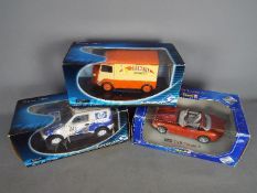 Revell, Solido - Three boxed 1:18 scale diecast model cars.